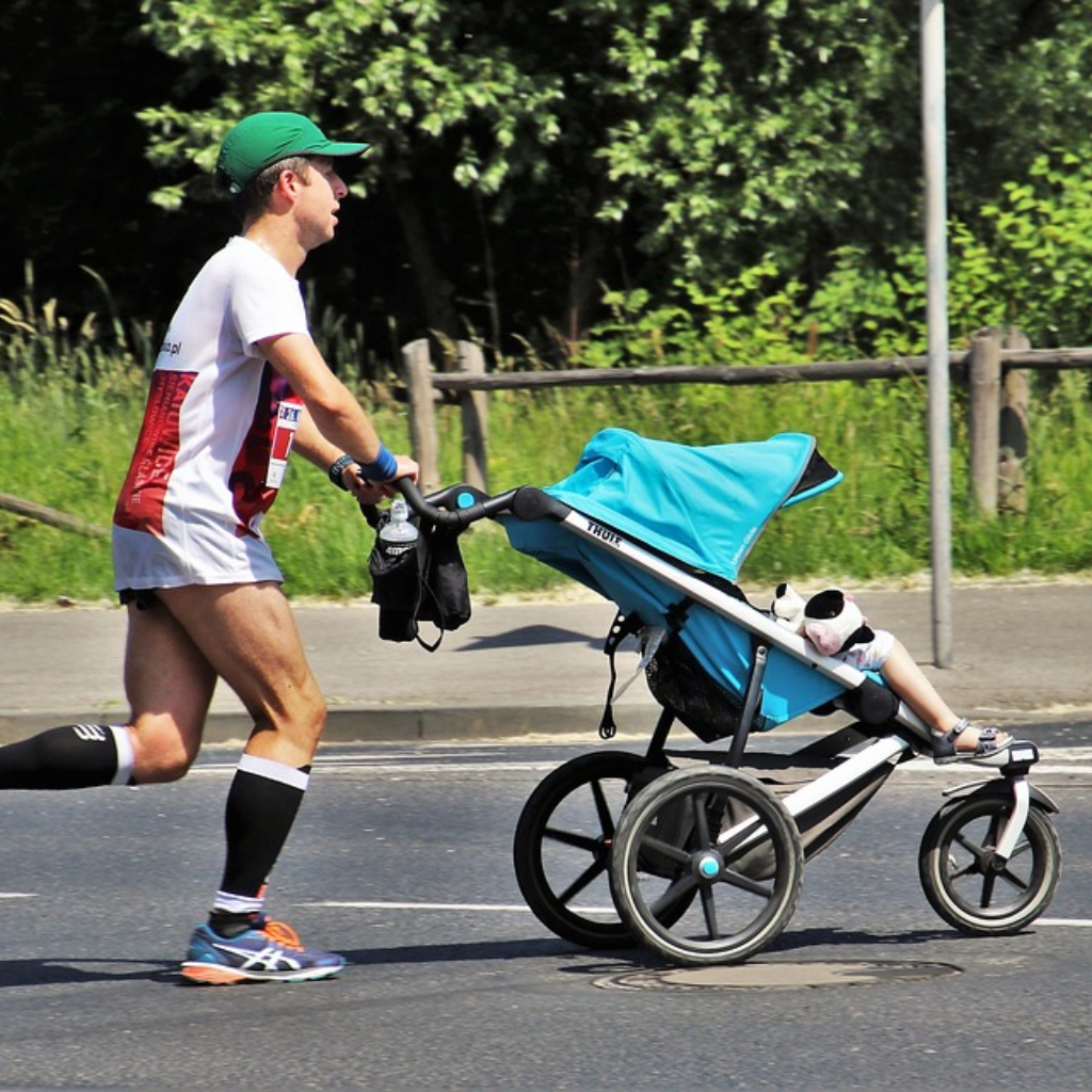 Father running with baby carriage
