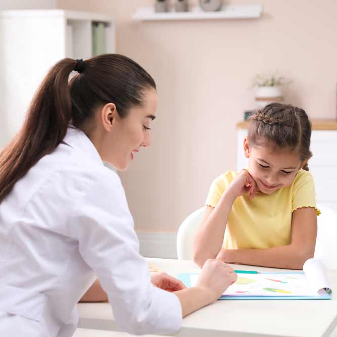 Doctor and child patient high fiving